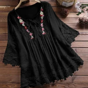 tunique dentelle noire avec motifs floraux